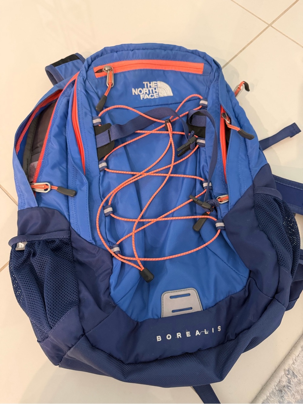 The North Face Blue Backpack with Orange Accents